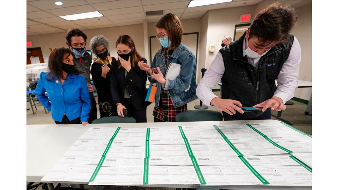Democratic and Republican canvas observers inspect Lehigh County provisional ballots as vote counting in the general election continues, Friday, Nov. 6, 2020, in Allentown, Pa. (AP Photo/Mary Altaffer)
