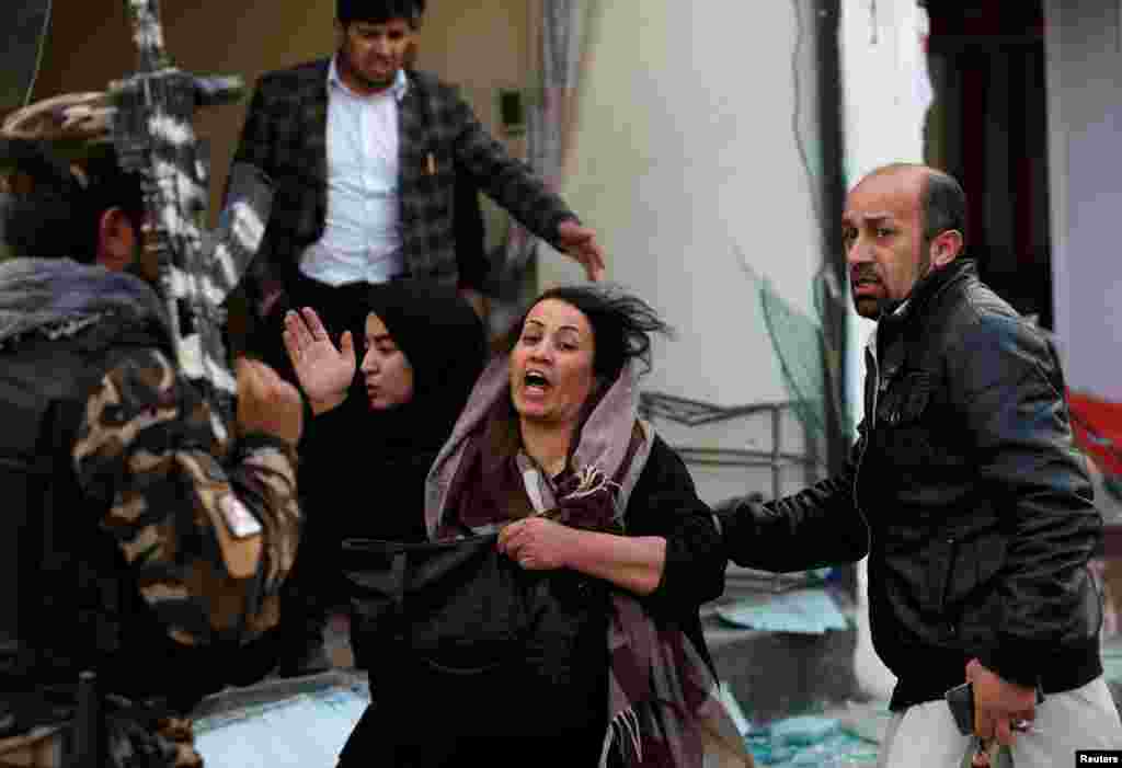 A survivor reacts at the site of a blast in Kabul, Afghanistan.