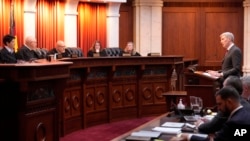 FILE - Attorney Eric Olson, far right, argues before the Colorado Supreme Court in Denver, Dec. 6, 2023. The Colorado Supreme Court on Tuesday declared Trump ineligible for the White House under the U.S. Constitution’s insurrection clause.