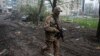 A Ukrainian soldier walks in in Bakhmut, Donetsk region, Ukraine, April 21, 2023. 