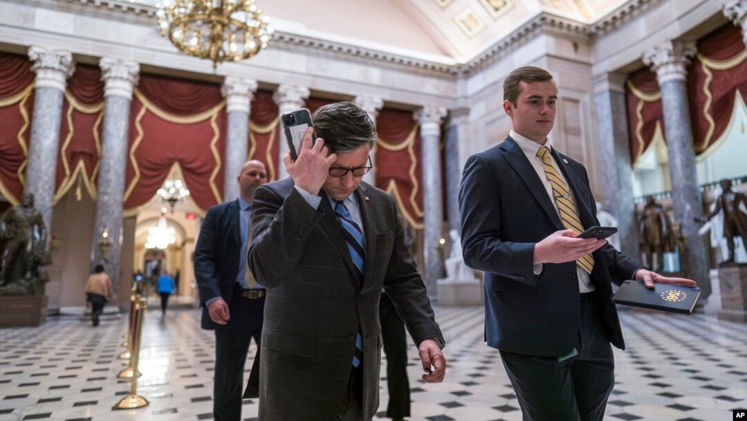 FILE - Republican House Speaker Mike Johnson walks through Statuary Hall as lawmakers gather to vote on the articles of impeachment against Homeland Security Secretary Alejandro Mayorkas, at the Capitol in Washington, Feb. 6, 2024. A first vote last week failed.
