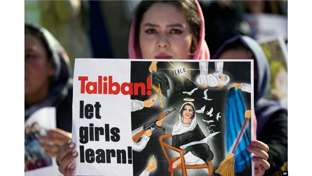 An Afghan refugee woman rallies to mark International Women's Day, in Islamabad, Pakistan, March 8, 2023. The day, officially recognized by the United Nations in 1977, is celebrated around the world on March 8.