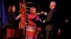 Minnesota Governor Tim Walz fist bumps Lieutenant Governor Peggy Flanagan during the governor's inauguration at the Fitzgerald Theater in St. Paul, Minn., Jan. 7, 2019.