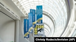 Banners advertise information about Comic-Con International in San Diego, California, July 26, 2024. (Photo by Christy Radecic/Invision via AP)