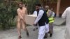 FILE - Volunteers in Basham, Pakistan, on March 26, 2024, carry the casket of a Chinese national killed in a bombing. The Afghan Taliban on May 31 rejected Pakistan's attribution of the blast to militants operating from Afghanistan.