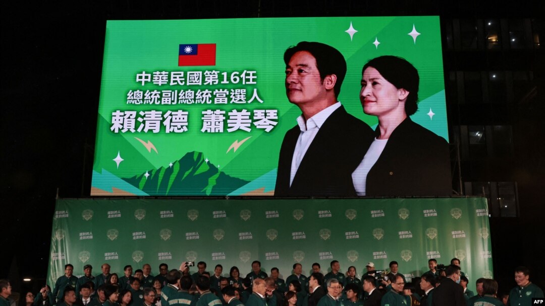FILE - A display shows Taiwan's President-elect Lai Ching-te and his running mate Hsiao Bi-khim during a rally outside the headquarters of the Democratic Progressive Party (DPP) in Taipei on January 13, 2024, after Lai won the presidential election. (Yasuyoshi CHIBA / AFP)