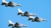 FILE - U.S.-made F-16 fighter jets fly over Warsaw, Poland, to celebrate the Polish Army Day, Aug. 15, 2023. Ukraine has received the first tranche of western F-16 fighter jets that it sought to help it fight Russian missile strikes, a U.S. official confirmed to the AP.