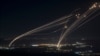 The Israeli Iron Dome air defense system fires profectiles to intercept an attack from Lebanon over the Galilee region as seen from the Israeli-annexed Golan Heights, Aug. 4, 2024. 