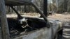A vehicle is seen scorched by the Park Fire in the Cohasset community of Butte County, Calif., July 29, 2024. Firefighters made some progress over the weekend in the battle against wildfires in the western U.S. 