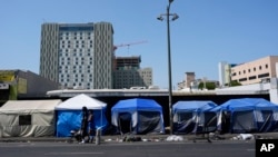 Tents are lined up in the Skid Row neighborhood of Los Angeles, July 25, 2024. California Gov. Gavin Newsom issued an executive order Thursday to direct state agencies on how to remove homeless encampments.