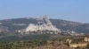 Smoke billows following an Israeli airstrike in the southern Lebanese border village of Chihine, July 28, 2024. Deadly cross-border exchanges have escalated between Israeli troops and mainly Hezbollah fighters on the Israel-Lebanon frontier.