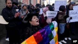 Alicia Chura, a supporter of Bolivian President Luis Arce, shouts against a now-ousted Bolivian army chief who led some soldiers to storm the presidential palace, outside police offices in La Paz, Bolivia, June 27, 2024.