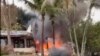 This frame grab from video shows fire coming from a plane that crashed by a home in Vinhedo, Sao Paulo state, Brazil, Aug. 9, 2024.