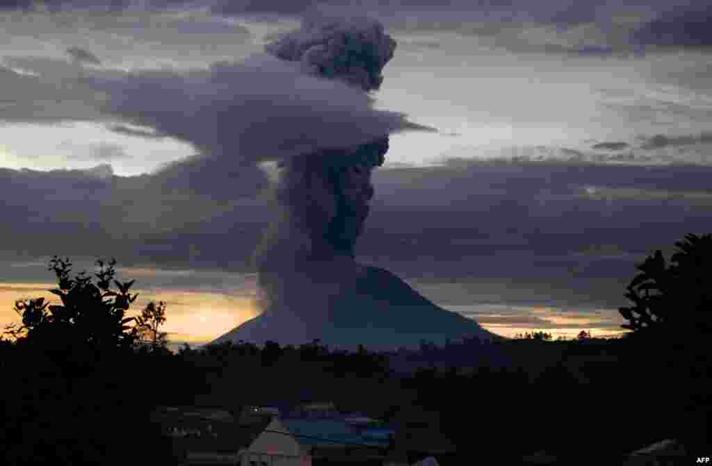 Mount Sinabung volcano spews thick volcanic ash, as seen from Brastagi, in Karo, North Sumatra province, Indonesia.