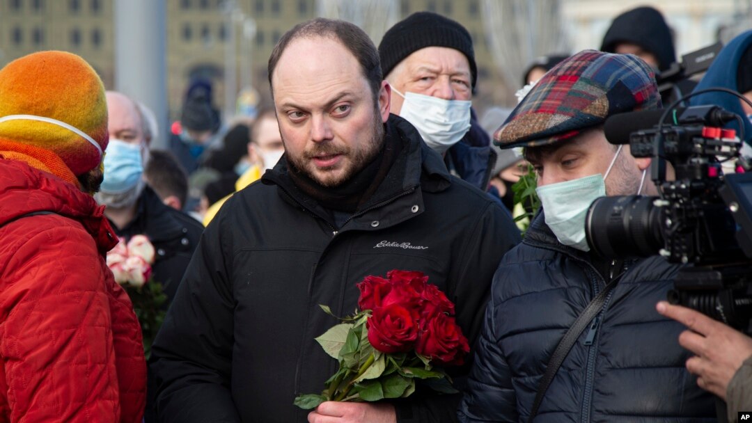 FILE - Vladimir Kara-Murza, Russian opposition activist, center, arrives to lay flowers near the place where opposition leader Boris Nemtsov was gunned down, in Moscow, Feb. 27, 2021. 