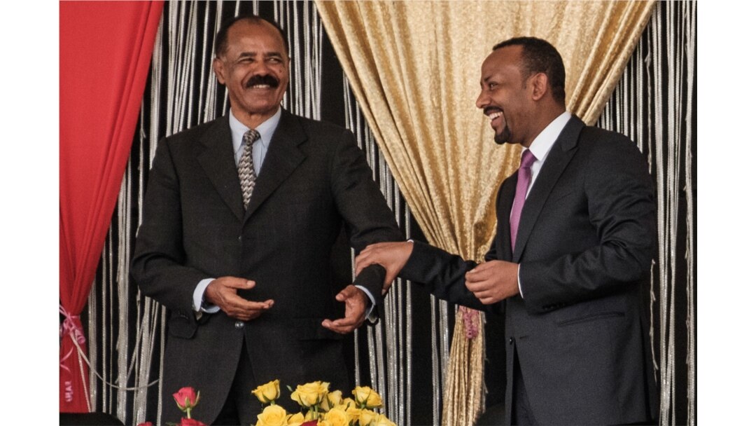 FILE - Eritrea's President Isaias Afwerki, left, and Ethiopia's Prime Minister Abiy Ahmed talk during the inauguration of the Tibebe Ghion Specialized Hospital in Bahir Dar, northern Ethiopia, Nov. 10, 2018.