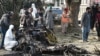 Policemen collect evidence at the suicide blast site in Islamabad on Dec. 23, 2022.