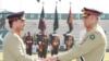 Pakistan's outgoing army chief General Qamar Javed Bajwa, right, handed over the symbolic baton to his successor, General Asim Munir, at a ceremony at the general headquarters in Rawalpindi, Nov. 29, 2022. (Photo courtesy of Inter Services Public Relations)