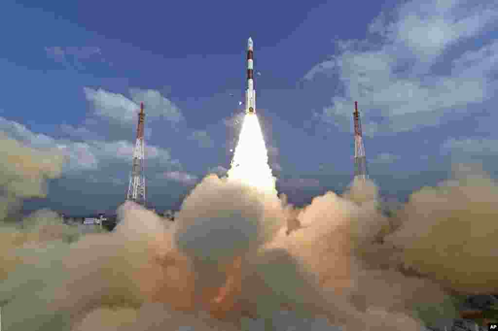 This photograph released by India's Space Research Organization shows its polar satellite launch vehicle lifting off from a launch pad at the Satish Dhawan Space Centre in Sriharikota.