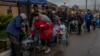 Residents queue to fill containers with drinking water in Kherson, southern Ukraine, Nov. 20, 2022. 