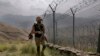 FILE - In this Aug. 3, 2021 file photo, Pakistan Army troops patrol the Pakistan-Afghanistan border. Pakistan warned Dec. 1, 2022, that cross-border terrorism emanating from Afghanistan “is both alarming and dangerous” for regional peace.