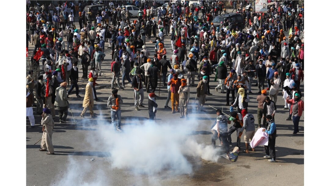 Farmers protest against the newly passed farm bills at Singhu border near Delhi, India, Nov. 27, 2020.