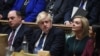 A handout photograph released by the UK Parliament shows Britain's Defense Secretary Ben Wallace (L), Prime Minister Boris Johnson (C) and Foreign Secretary Liz Truss (2nd R) attending a session in the House of Commons, in London, Feb. 24, 2022.