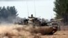 Turkish tanks head towards the Syrian border, in Karkamis, Turkey, Aug. 31, 2016. 