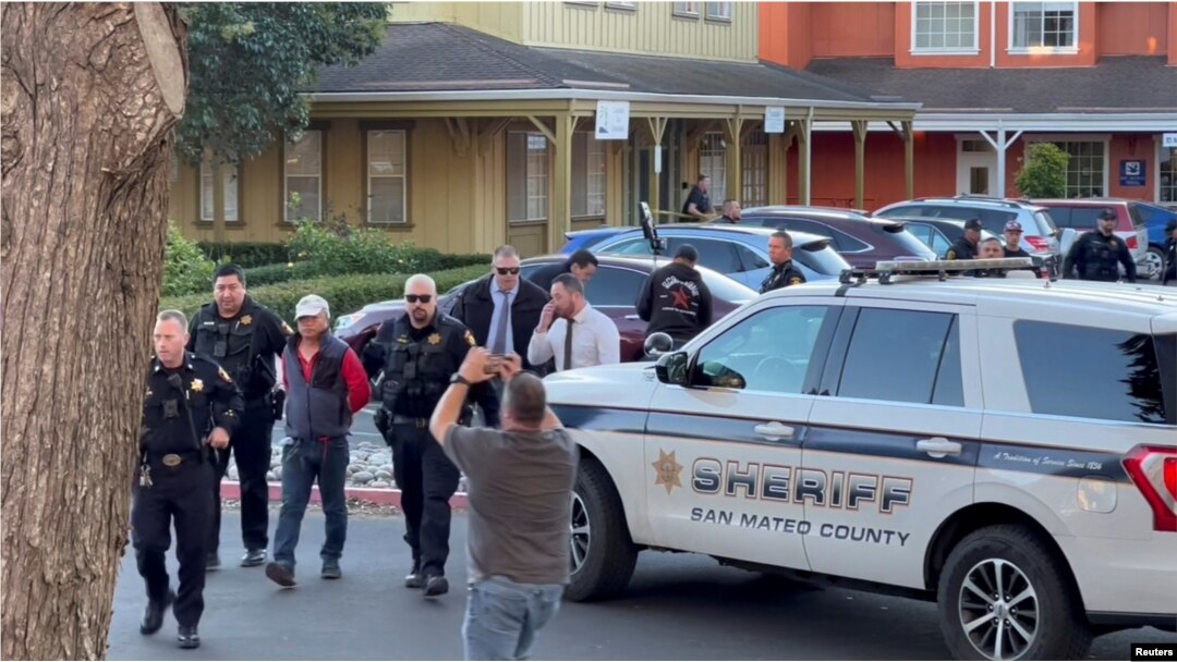 Police officers detain a man, believed by law enforcement to be the Half Moon Bay mass shooting suspect, in Half Moon Bay, California, U.S., January 23, 2023, in this screengrab taken from a social media video. (Kati McHugh via REUTERS)
