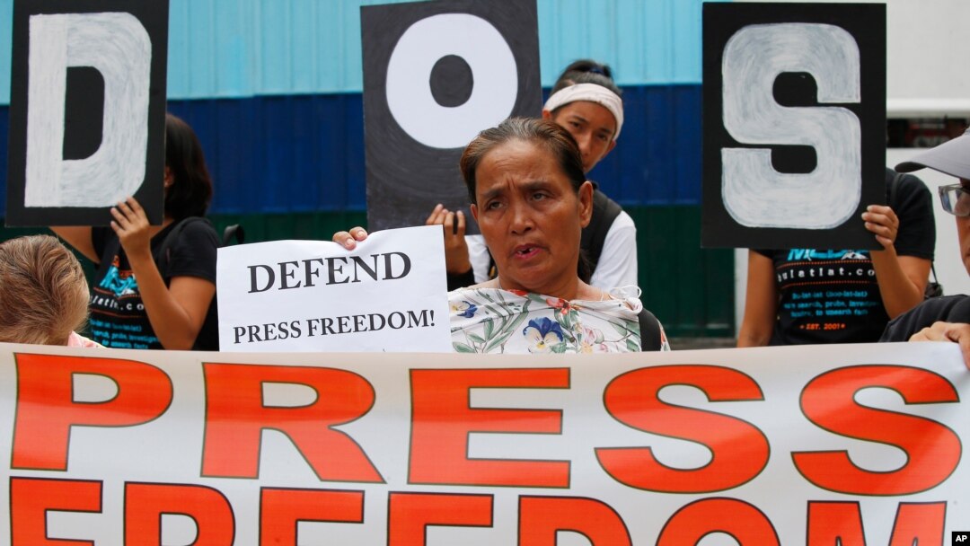 FILE - Protesters rally outside the armed forces headquarters to mark World Press Freedom Day which was declared by the U.N. General Assembly in Manila, Philippines, May 3, 2019. 