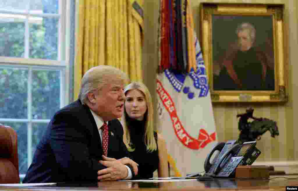 U.S. President Donald Trump and his daughter Ivanka hold a video conference call with Commander Peggy Whitson and Flight Engineer Jack Fischer of NASA on the International Space Station from the Oval Office of the White House in Washington, U.S.