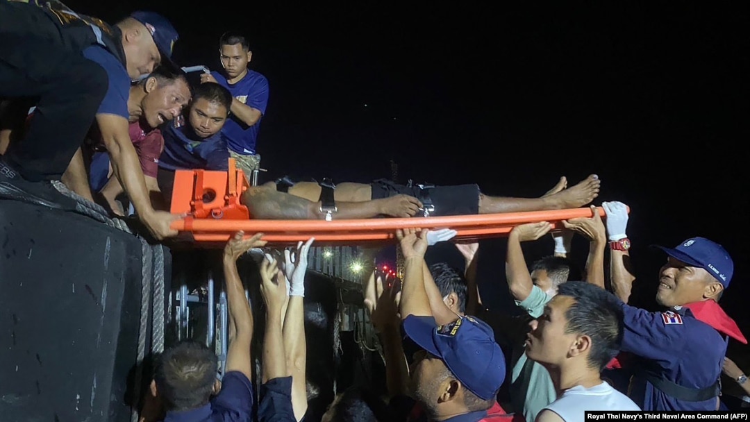 An injured fisherman is carried on a stretcher at a port in Ranong in Thailand near the Myanmar border in this handout photo taken Nov. 30, 2024 and released Dec. 2.