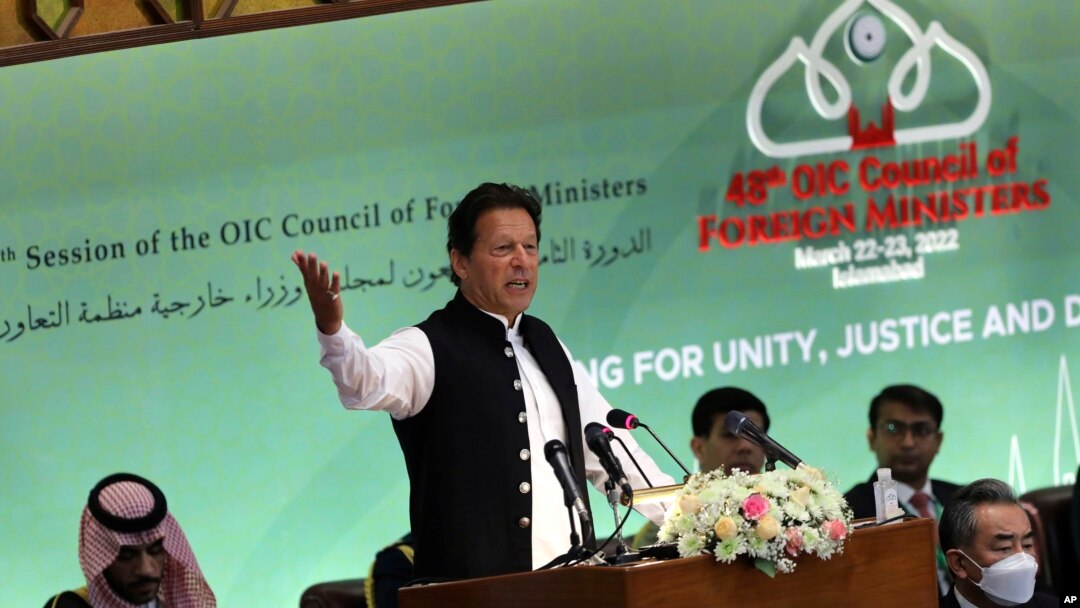 Pakistan's Prime Minister Imran Khan speaks at the start of a two-day gathering of the 57-member Organization of Islamic Cooperation, at the Parliament House in Islamabad, March 22, 2022.