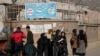 FILE - Afghan women students stand outside the Kabul University in Kabul, Afghanistan, Dec. 21, 2022. The United Nations' human rights chief on Dec. 27, 2022, decried increasing restrictions on women's rights in Afghanistan.