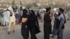 FILE - People walk through a street in Fayzabad of Badakhshan province, Sept. 15, 2022. A car bomb set off in the city, reportedly by IS-Khorasan, killed a provincial police chief and his two guards, according to Taliban authorities. 