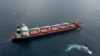 FILE - The Sierra Leone-flagged cargo vessel Razoni en route to Tripoli, Lebanon, along the Bosphorus Strait, Aug. 3, 2022, after being inspected. Inspections of ships carrying Ukrainian grain and other food exports have slowed to half their peak rate.