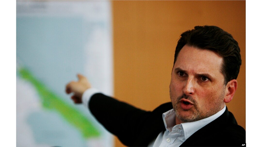 FILE - Pierre Kraehenbuehl, then the operations director of the international Red Cross (ICRC), points to a map during a press conference in Geneva, Switzerland, April 21, 2009.