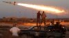 Fighters of Libyan forces allied with the U.N.-backed government fire a rocket at Islamic State fighters in Sirte, Libya, August 4, 2016.