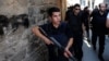 Turkish police officers conduct a security operation in Diyarbakir, southeastern Turkey, Aug. 15, 2015. Human Rights Watch accuses Turkish security forces of committing acts of abuse against civilians in their fight against the Kurdish rebel group, the PKK.