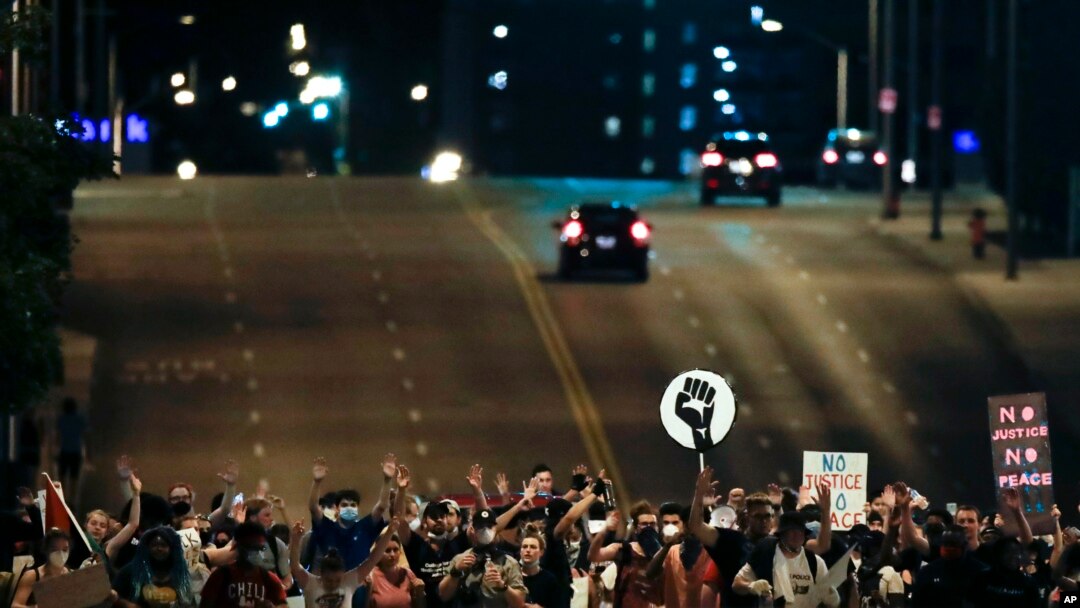 Demonstrators march up Main Street in Kansas City, Mo. June 4, 2020, during a protest over the death of George Floyd, who died May 25 after being restrained by police in Minneapolis. 