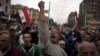 Egyptian protesters chant anti-Muslim Brotherhood slogans during a rally in front of the presidential palace, in Cairo, Egypt, Dec. 4, 2012.