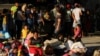 Venezuelan migrants are seen inside a coliseum where a temporary camp has been set up, after fleeing their country due to military operations, according to the Colombian migration agency, in Arauquita, Colombia, March 27, 2021. 