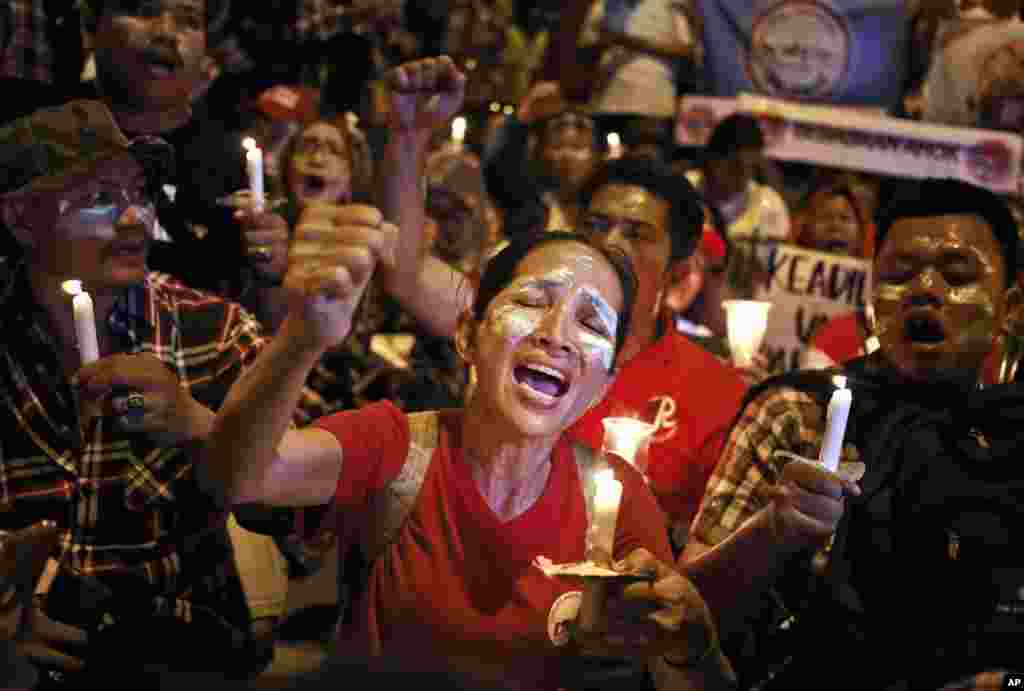 Supporters of Jakarta Governor Basuki "Ahok" Tjahaja Purnama shout slogans during a rally outside Cipinang Prison where he is being held after a court sentenced him to two years in prison, in Jakarta, Indonesia.
