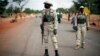 Malian soldiers man a checkpoint on the Gao road outside Sevare, some 620 kilometers (385 miles) north of Mali's capital Bamako, Jan. 27, 2013.