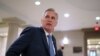 House Minority Leader Kevin McCarthy, R-Calif., and fellow Republicans gather to consider a replacement for Rep. Liz Cheney, R-Wyo., was ousted from the GOP leadership for criticizing former President Donald Trump, at the Capitol, May 13, 2021.
