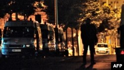 French anti-riot police vehicles are parked in the northern French city of Amiens two days after a district of the city was left devastated by riots, August 15, 2012.