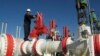 FILE - A worker checks valves on the Yapracik gas pipeline on the outskirts of Ankara, Turkey, Jan. 9, 2009.