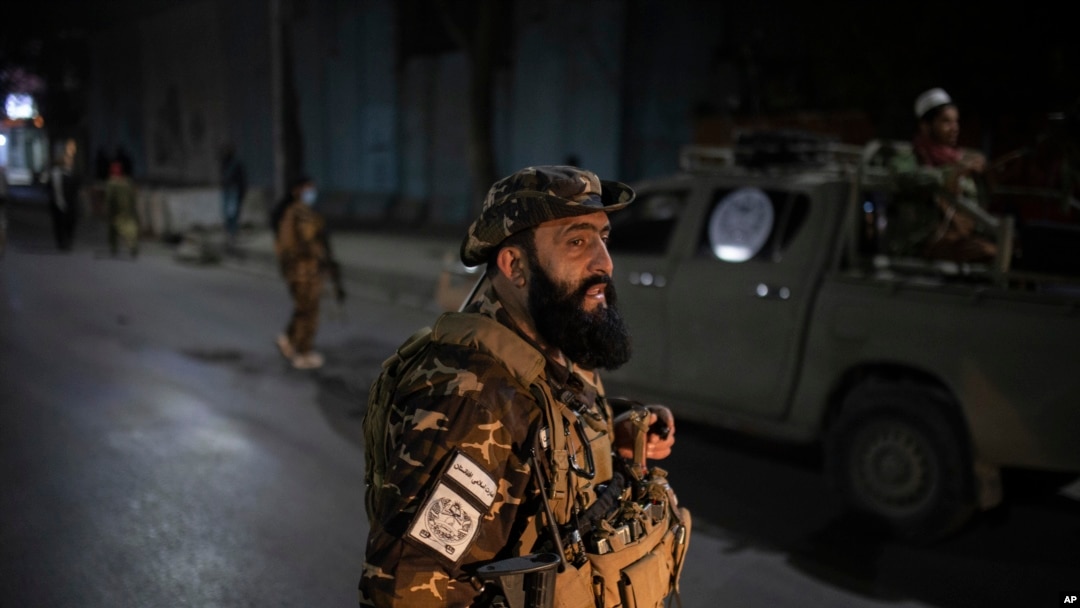 Taliban fighters block roads after an explosion Tuesday, Nov. 2, 2021. An explosion went off Tuesday at the entrance of a military hospital in Kabul, killing several people and wounding over a dozen, health officials said.