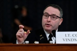 FILE - National Security Council aide Lt. Col. Alexander Vindman testifies before the House Intelligence Committee on Capitol Hill in Washington, Nov. 19, 2019.