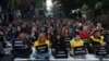 The students of Ankara University hold the placards with the names of those killed in Saturday's deadly explosions during a sit-in protest in Ankara, Turkey, Oct. 13, 2015. 